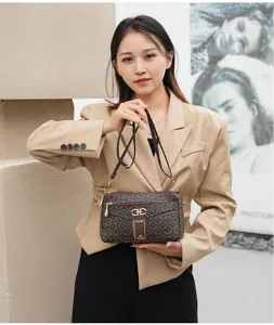 Stylish women's monogram crossbody shoulder bag with chic metal hardware and adjustable strap.