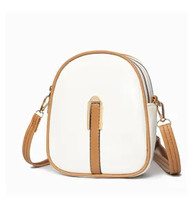 White and brown small crossbody phone bag for women, minimalist vertical design with double zippers.