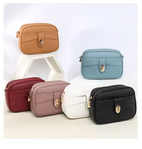 Minimalist solid color crossbody small square bag detail, showing clean stitching and hardware.
