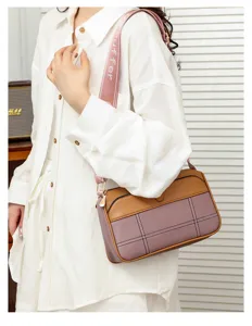 Stylish women's color-block crossbody shoulder bag with wide printed strap for daily wear.