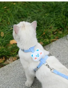 Cute blue cat harness vest detail with soft plush bear decor for safe outdoor walking.