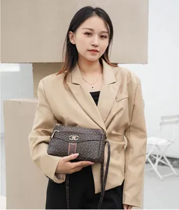 Stylish women crossbody shoulder bag with monogram pattern and elegant metal hardware design.