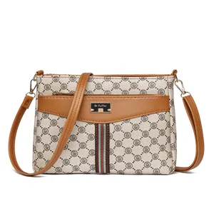 Women's vintage shoulder crossbody bag with monogram pattern and brown PU leather trim.
