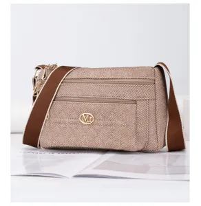 Sac bandouliere en toile style Coreen avec plusieurs compartiments pour les femmes.