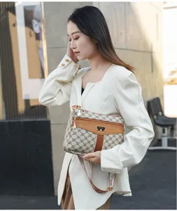 Stylish women's shoulder bag with monogram pattern, versatile crossbody bag for daily use.