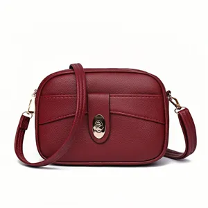 Minimalist red leather crossbody bag for women, stylish small square messenger bag.
