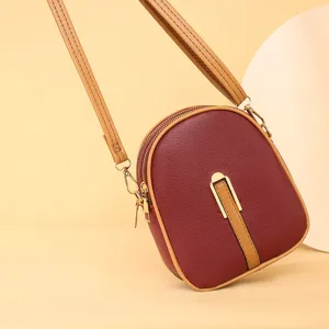 Women crossbody phone bag stylish small vertical shoulder bag with contrast color design.