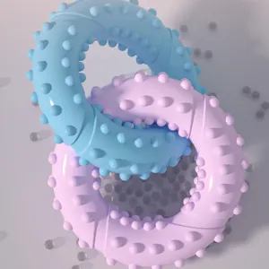 Detail view of the colorful TPR double ring pet chew toy with spike textures for dogs.