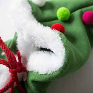 Christmas pet cat dog cloak green knitted shawl with white plush trim and colorful pom poms.