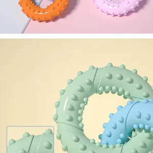Close-up detail of durable TPR pet teething ring toys with textured spikes for dog dental health.