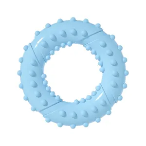 Light blue TPR dog chew toy with textured bumps, durable teething ring for puppies and pets.
