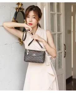 Vintage monogram shoulder bag for women, brown pattern crossbody bag with metal lock.