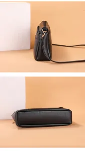 Detailed view of black PU leather women crossbody bag showing side profile and bottom structure.