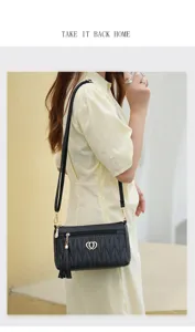 Women black crossbody bag summer casual shoulder bag with tassel and heart charm for daily use