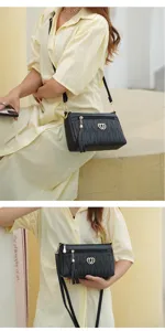 Stylish black leather crossbody bag for women with tassel and metal heart decoration, daily use.