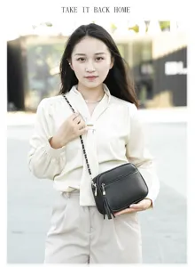 Trendy women's black leather crossbody shoulder bag with chain strap and tassel detail for daily use.