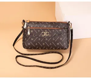 Vintage women monogram crossbody bag detail, brown leather shoulder bag with multi zip.