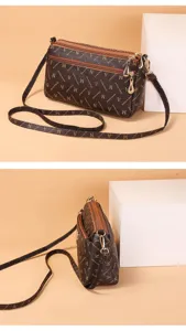 Retro monogram women crossbody bag with multi-zipper compartments and shoulder strap.