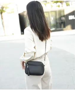 Women's black crossbody bag with chain strap and tassel, stylish daily shoulder bag for ladies