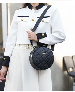 Stylish black round quilted crossbody bag for women, chic shoulder purse with wide strap.