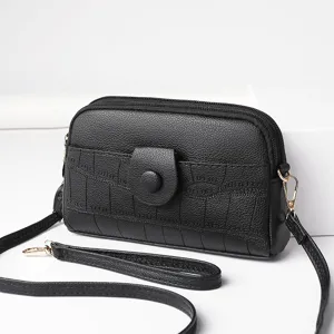 Black crossbody mini phone bag with multiple zipper compartments and adjustable strap for women.