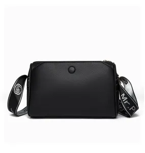 Stylish black leather women crossbody shoulder bag with multi-layer zipper and wide strap.