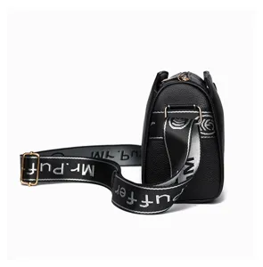 Detailed close-up view of black women's crossbody bag featuring wide logo strap and zipper.