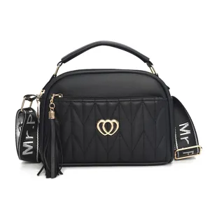 Black PU leather handbag for women, stylish shoulder bag with tassel and heart hardware.