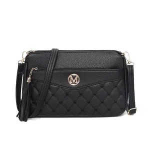 Black quilted leather crossbody bag with tassel and gold M logo for women daily commuting