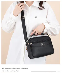 Stylish black PU leather crossbody bag for women, featuring a top handle and adjustable strap.