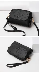 Black leather mini crossbody bag with embossed floral pattern, stylish daily shoulder bag.