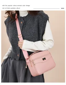 Detailed view of the stylish pink PU leather crossbody bag worn by model, casual and chic.