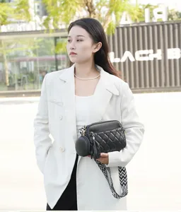 Stylish women crossbody bag with quilted design, wide strap and small round pouch for daily use.