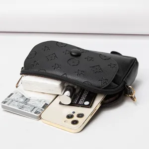 Black mini crossbody bag with embossed pattern, stylish small shoulder bag for women daily use.