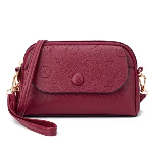 Dark red women's crossbody mini shoulder bag with embossed flower pattern and flap design