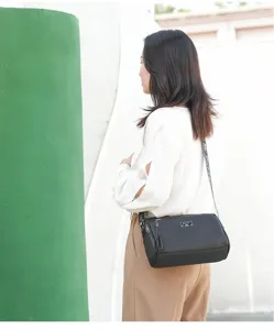 Women's casual black leather pillow crossbody bag, perfect for daily commuting and travel.
