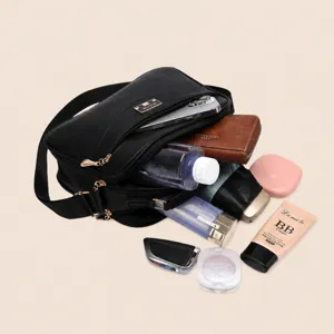 Black PU leather cross-body bag with large capacity, stylish shoulder bag for women.