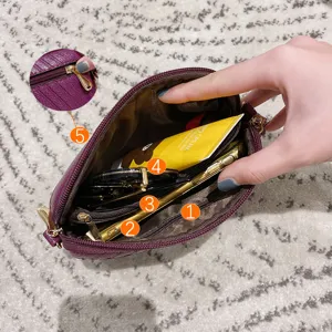 Stylish purple mini crossbody phone bag with multi-layer zipper pockets for daily use.