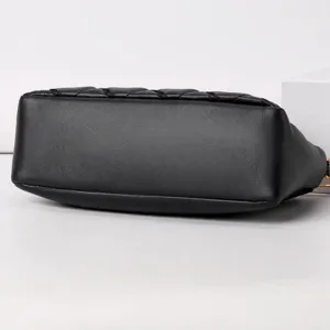 Black soft leather crossbody bag bottom view, chic quilted design stylish shoulder handbag.