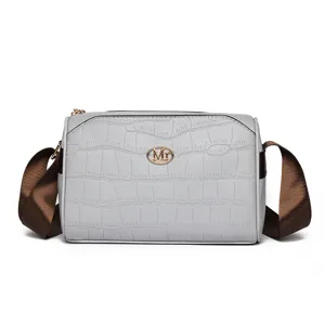 Grey crocodile pattern women crossbody bag with brown strap, stylish multi-layer detail.