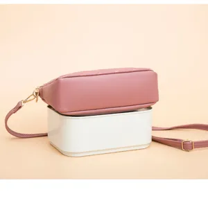 Pink quilted heart shoulder bag, detailed view showing soft PU leather, adjustable strap and gold hardware.