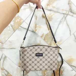 Stylish women monogram shoulder crossbody bag with multi-layer compartments and secure zippers.