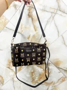 Multi-layer brown monogram crossbody bag with adjustable strap and large capacity for daily use.