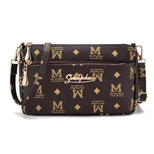 Brown multi-layer crossbody bag for women with monogram pattern and gold hardware.