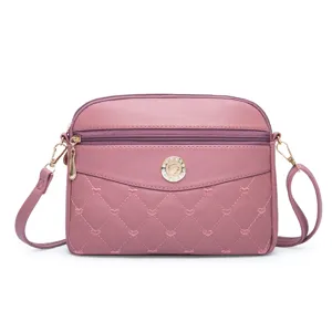 Pink PU leather crossbody bag for women, cute heart embroidery design with double zippers.