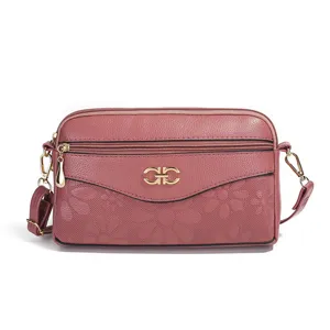 Women multi-layer crossbody bag, elegant floral embossed design with gold metal clasp.