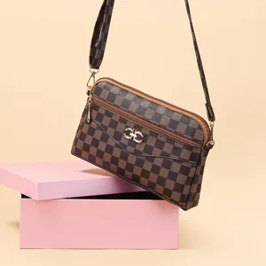 Classic brown checkered crossbody bag with multiple zipper compartments and stylish hardware.