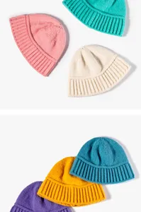 Knitted beanie hat detail view, cozy winter solid color rib cuff design product display.