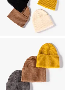 Detailed view of winter knitted beanies in various solid colors, warm and stylish headwear.