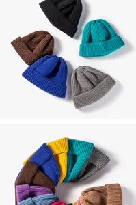 Close up view of multi-color knitted beanie hats, soft winter warm short docker caps.